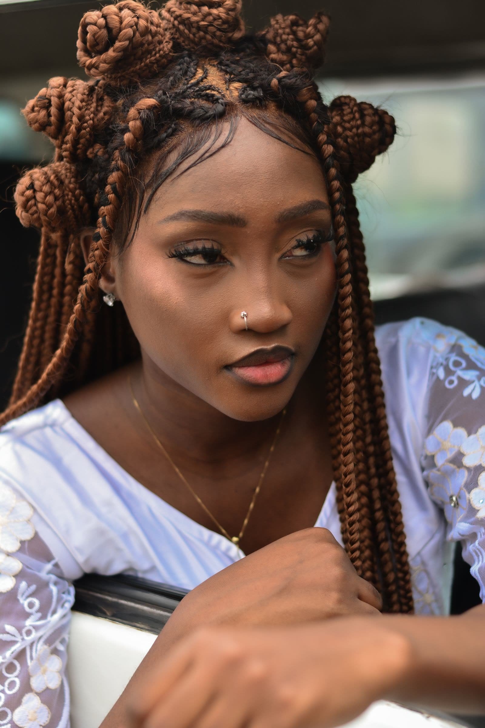 Editorial portrait with copper braided hairstyle