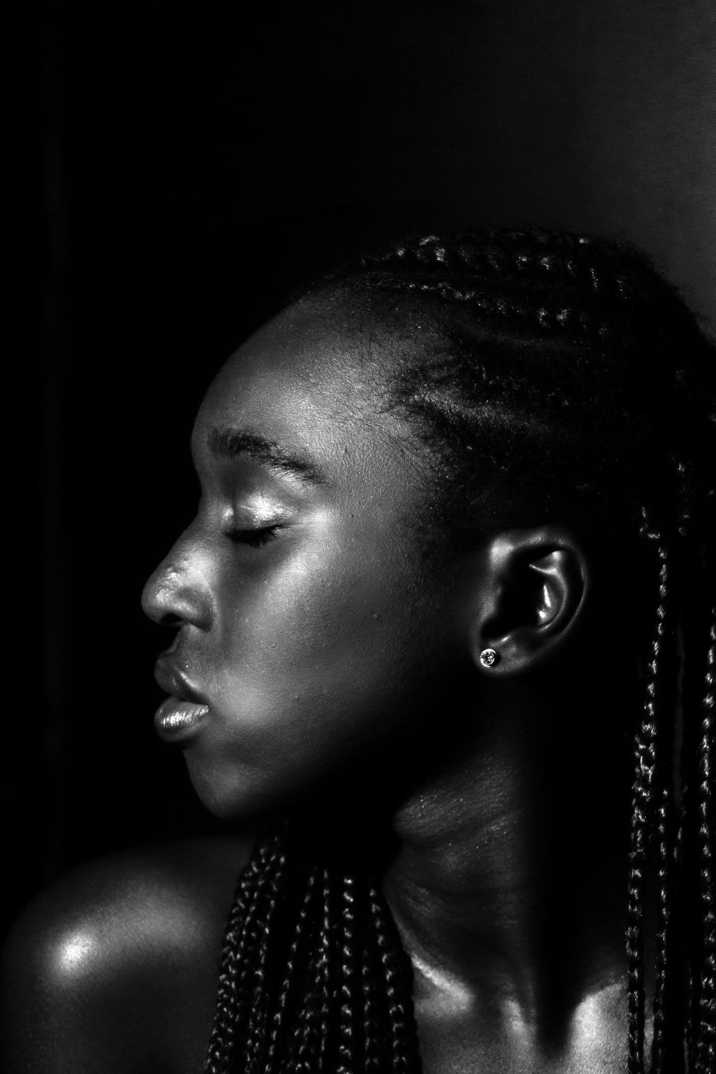 Monochrome side profile portrait with braids