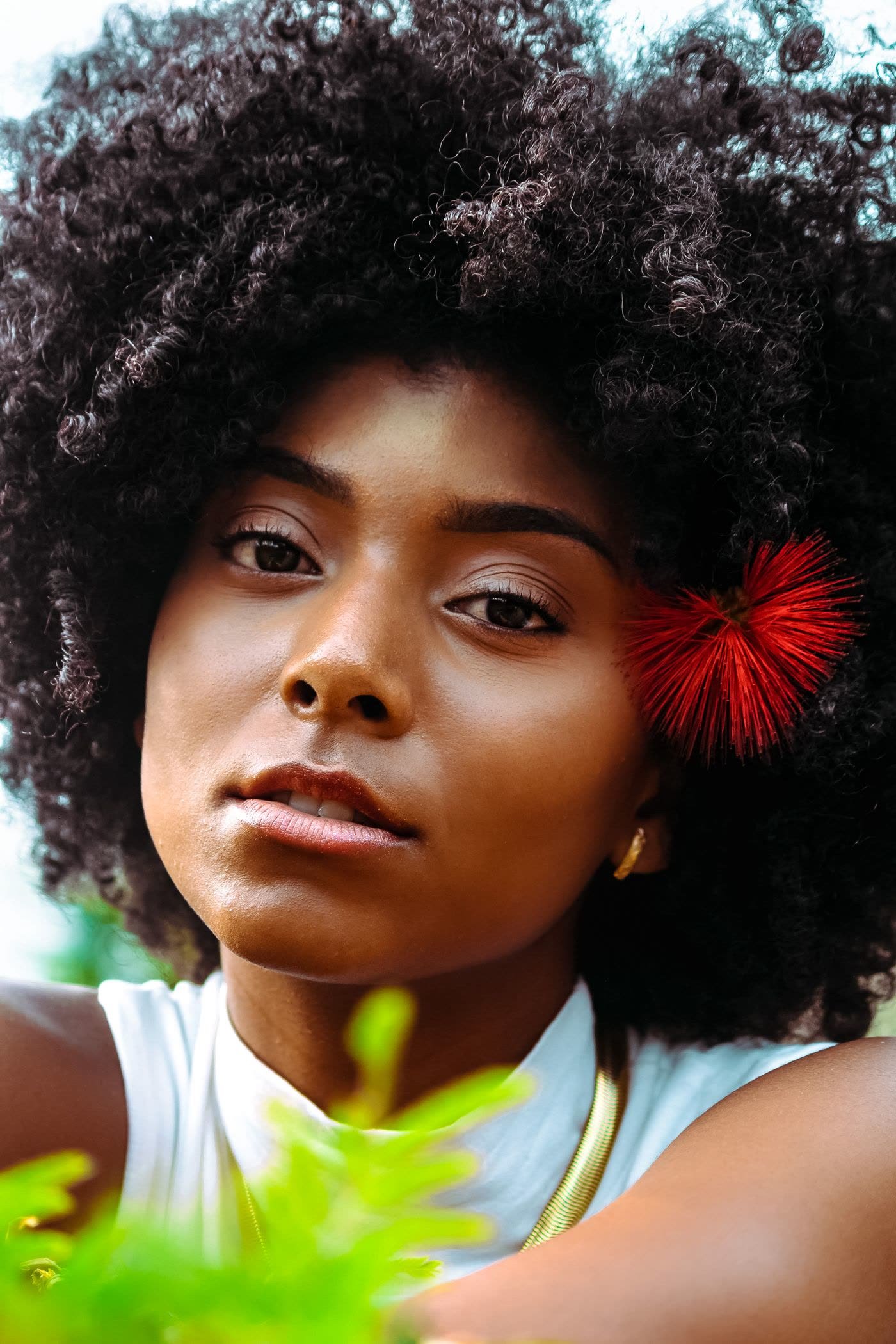 Natural afro portrait with statement accessory